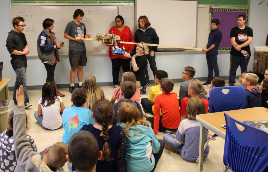 Robotics students share the robot they created with middle school students on Oct. 17. 