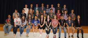 The UIL Academics regional qualifiers pose together with their district medals.
