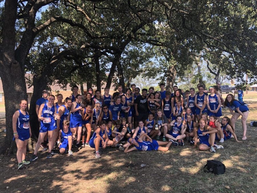 High school and middle school students celebrate together after boys ran 3.1 miles and girls ran 2 miles in Gatesville.