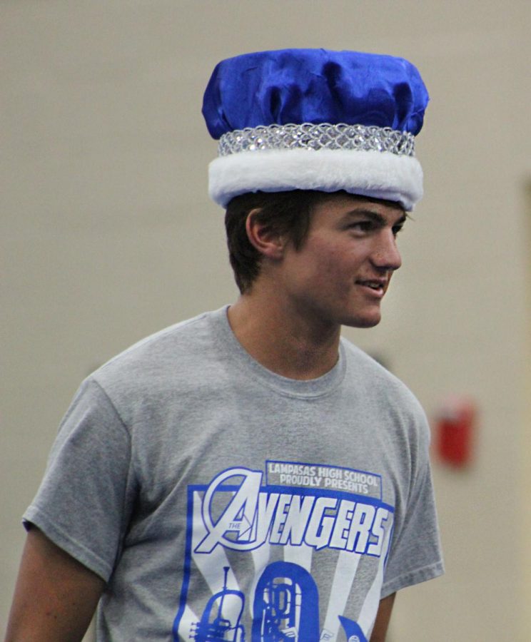 Senior Scooter Cook accepts the homecoming king crown during the pep rally on Sept. 20. 