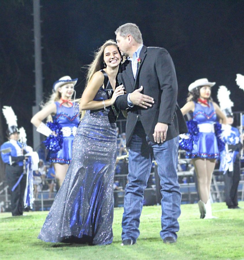 Jessica Ball hugs Sid Ball as she is announced homecoming queen. 