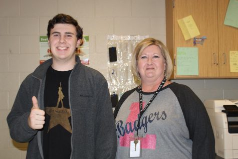 Junior Cole Wheeler stands with agriculture teacher Judy Hail. Wheeler earned the Texas Farm Bureau Youth Leadership scholarship. 