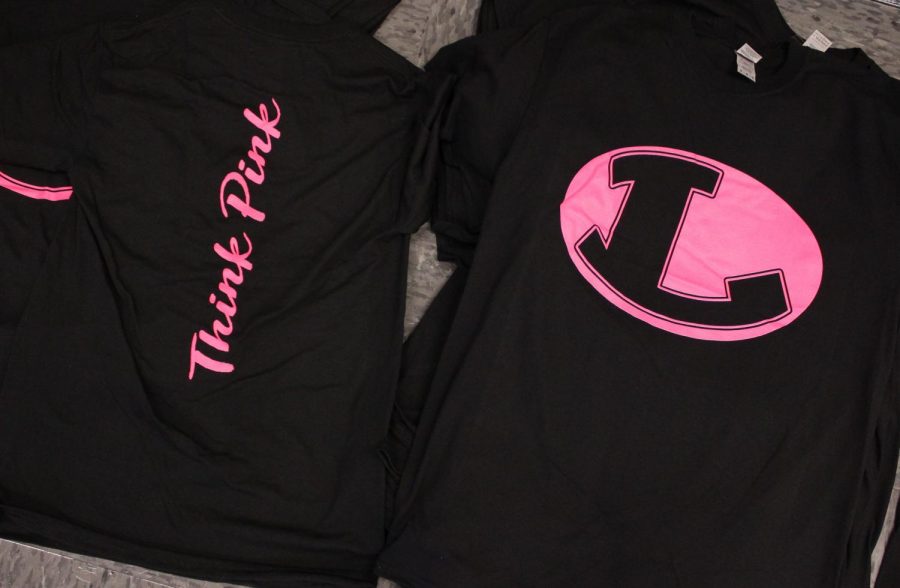 The back and front of the pink out shirts, which were sold by student council to raise awareness for breast cancer. 