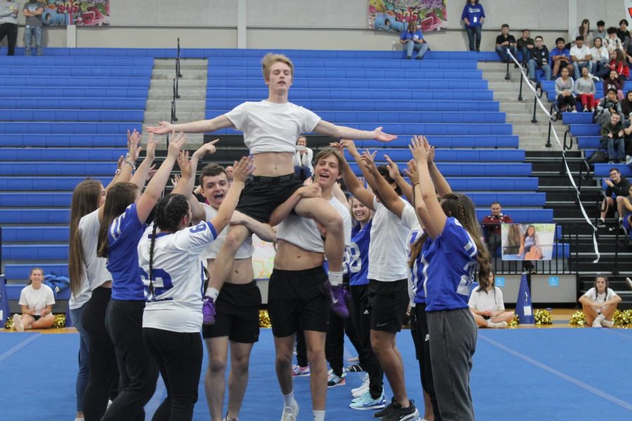 Seniors hold up Zeb Bender at senior pep rally Nov. 1.