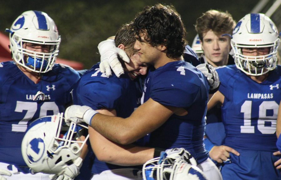 Seniors Austin Kielpinski and Ethan Rascoe hug after the loss to Carthage on Dec. 13. 