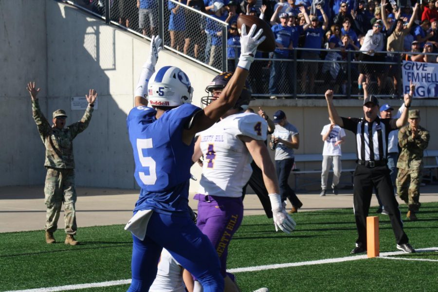 Senior Jaylon Porter and Badger football fans celebrate a touchdown against the Liberty Hill Panthers on Dec. 7.