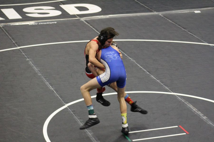 Sophomore Dillon Best does a take-down and achieves victory at the regional meet Feb. 14. 