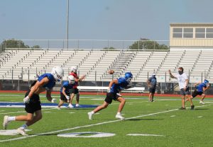 The football team practices after school. The first football game of the season is tomorrow at 7 p.m. at Badger Stadium.