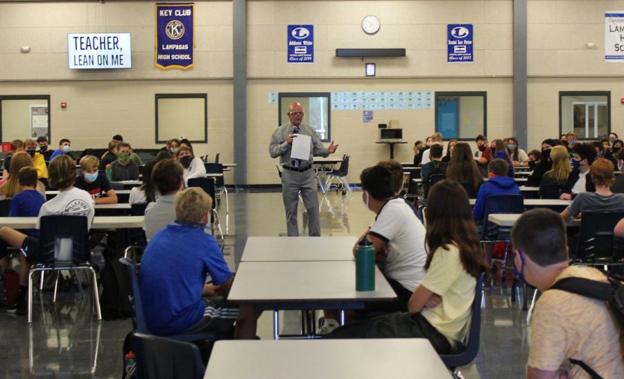 Principal+Joey+McQueen+speaks+to+freshmen+at+a+class+meeting+Aug.+17.+