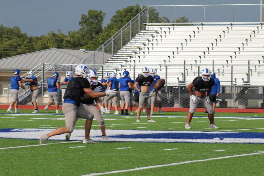 The football team practices after school Sept. 9. They play the Wimberly Texans tonight at 7:30. 