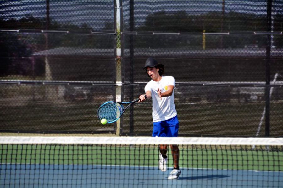Junior Elias Arellano plays singles against his Burnet opponent Aug 28.