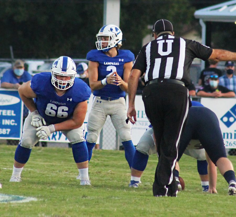  Senior Ace Whitehead calls the play as Senior Hayden Waldrip and other offensive linemen set up to block at the Badgers' 57-28 win against Wimberly Sept. 11.