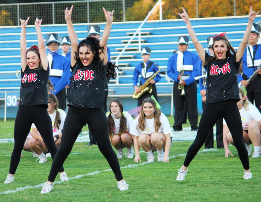 Senior+cheerleaders+Rose+McAnally%2C+Janice+Hanson+and+Lexi+Peters+perform+their+ACDC+number+at+the+pep+rally+Oct+21.