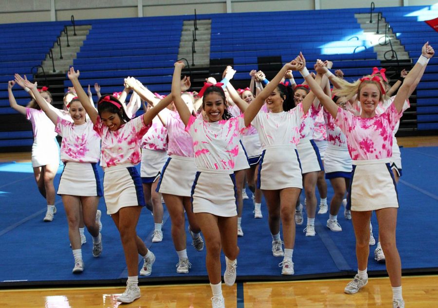 The cheerleaders recors their performance for the Pink Out pep rally.