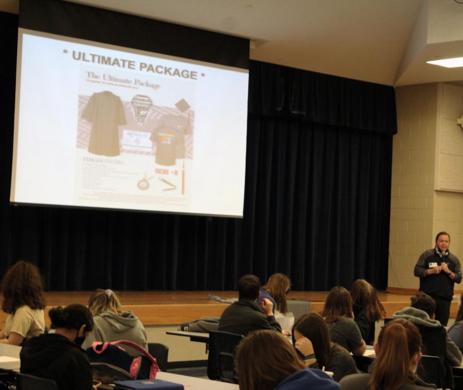 A Herff Jones representative speaks to the senior class about placing their cap and gown orders Nov. 4.   