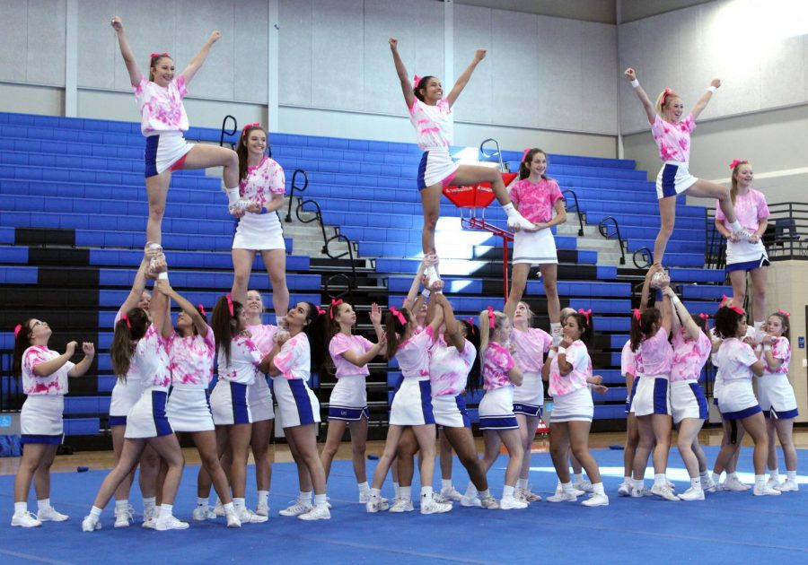 The+cheerleaders+record+their+performance+for+the+Pink+Out+pep+rally.+