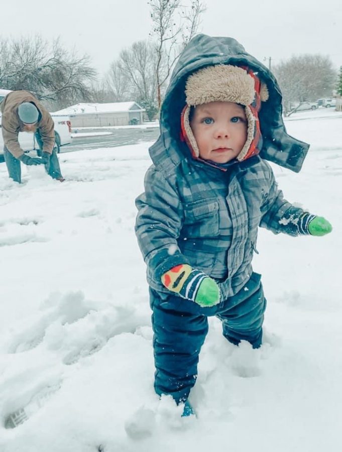 Coach Tanner McLeans 1-year-old son Tripp plays in the snow  Jan. 10. 