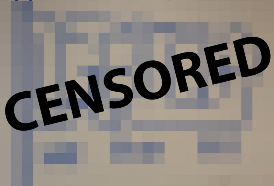 This is a censored image of the LGBTQ+ flag created with tape by art students. Administration took down the piece after unknown students vandalized it.