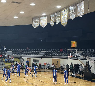 The basketball team warms up before the Area game against Argyle Feb. 25.