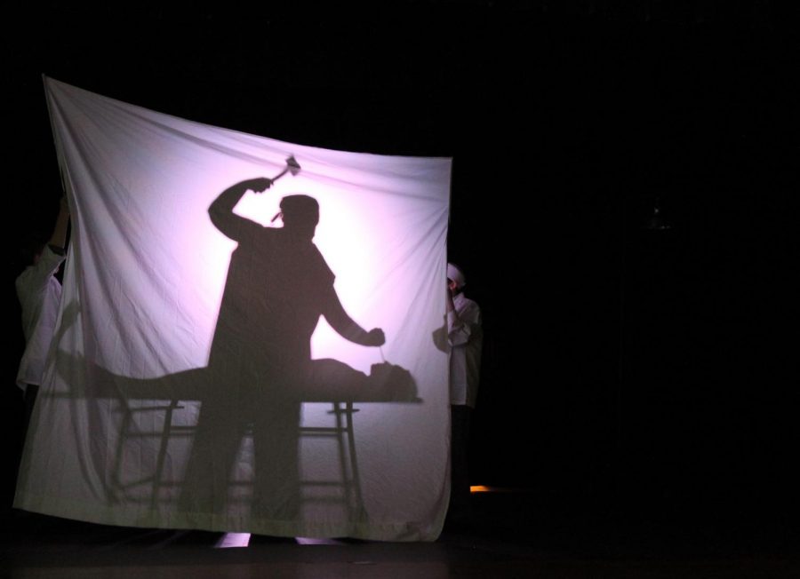 Junior Michael Neary, as his character Dr. Freeman, acts out a lobotomy on Abby Taylor in the role of Frances Farmer during their performance of Saint Frances of Hollywood.