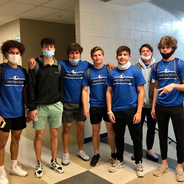 Members of the boys track team stand together before leaving for the Region 1 Meet. 