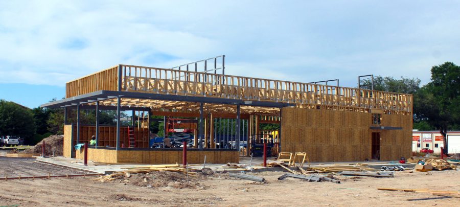 Construction workers build the Whataburger establishment May 7.