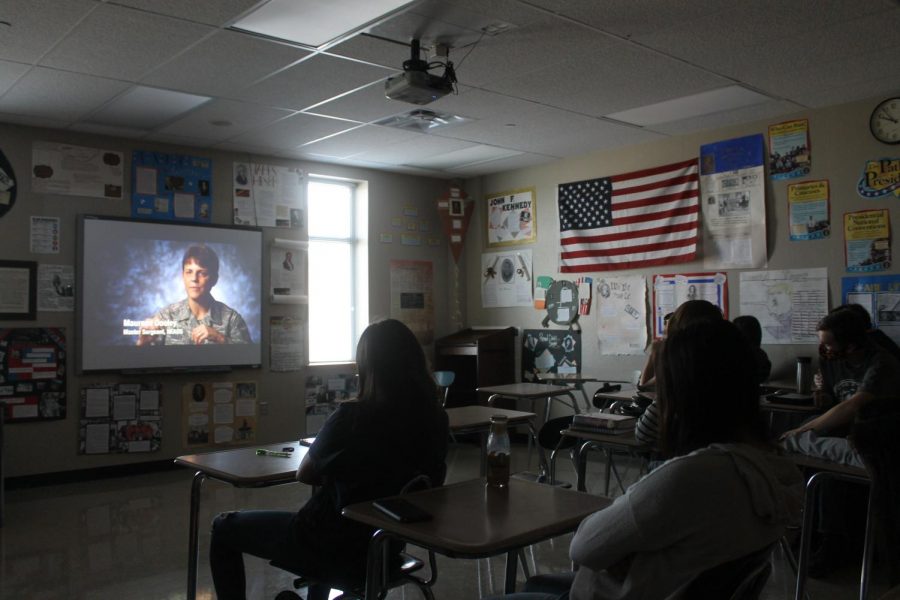 U.S. Government teacher Justin Schulze shows 9/11 videos to his class to help them understand the peoples point of view. 