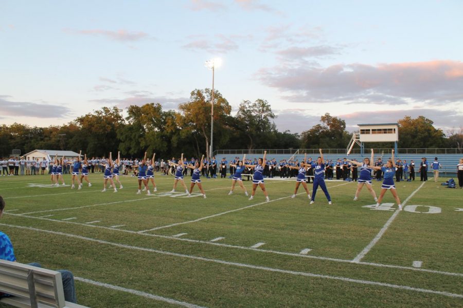 Cheerleaders perform at the pep rally at Badger Field Sept. 15. 