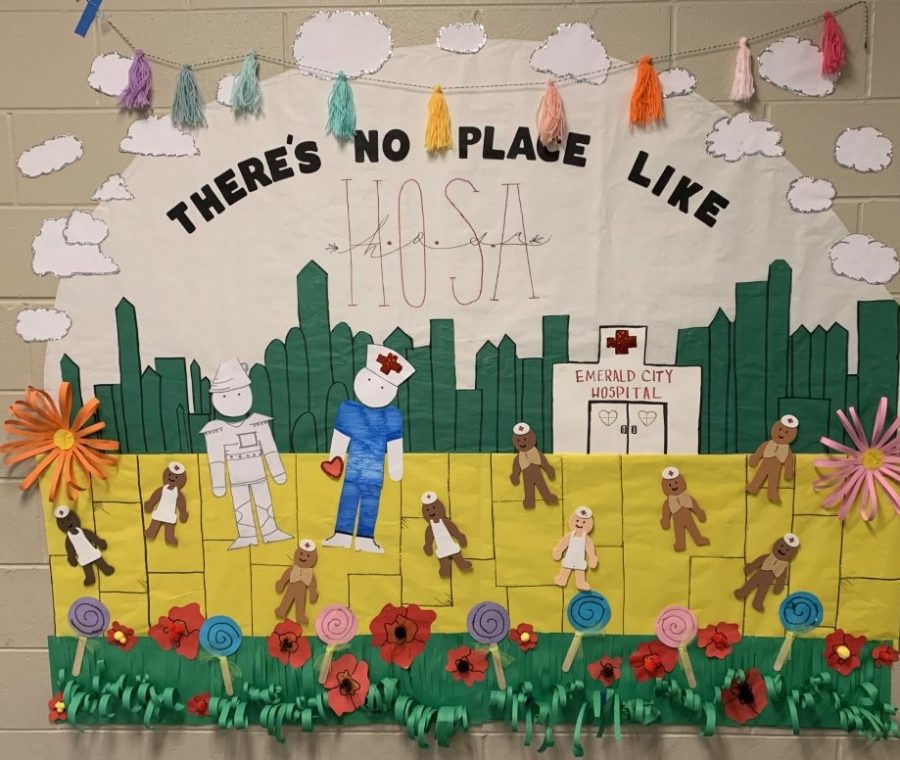 HOSA sponsor Christie Fords  door won first place in the Theres No Place Like HOMEcoming door decorating contest with this HOSA theme. 