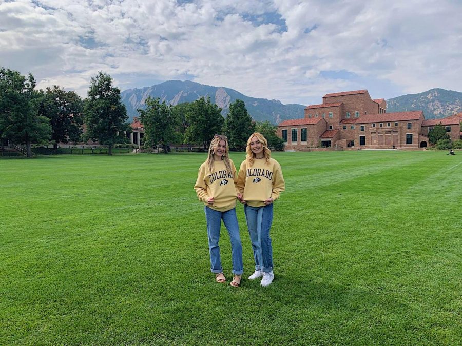 Seniors Kayla McManus and Lexi Moreland pose on the main field at Colorado University.
 