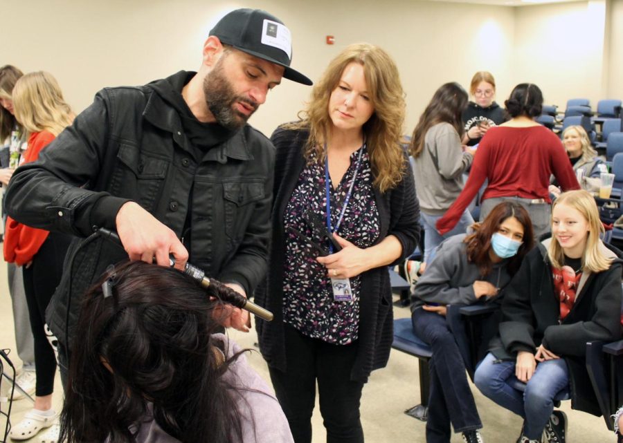 Ayala demonstrates a wave technique to students and cosmetology teacher Christine Hearn Feb. 24.