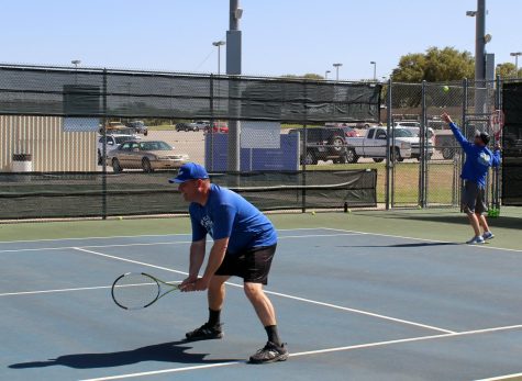 Assistant Principal Paul Weinheimer and Principal Joey McQueen play tennis against freshman Chesley Breuer and junior Madison Miles after school April 13.