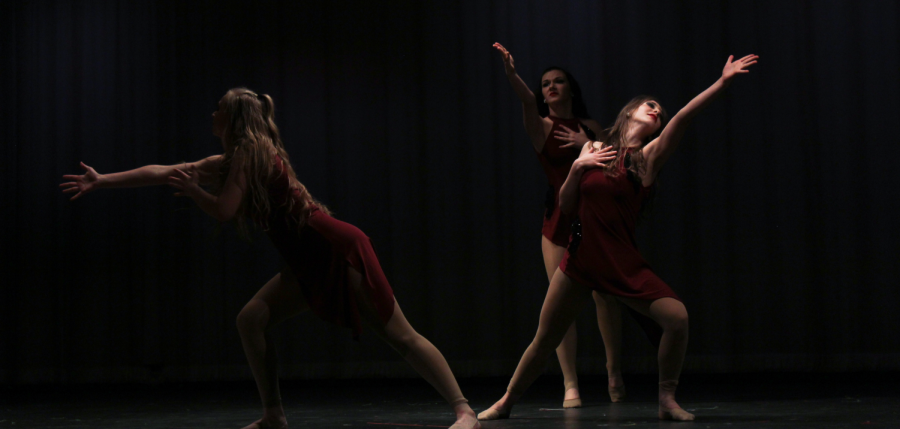 Flames officers Kelsey Grimmett, April Smith and Brooklyn Morris perform during the Spring Showcase.