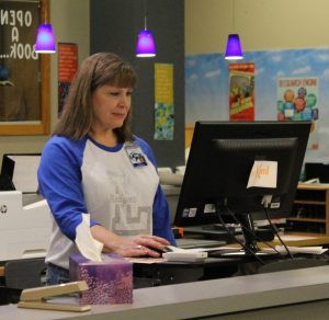 Former middle school art teacher Misti Harrell works in the library Mondays and Tuesdays.