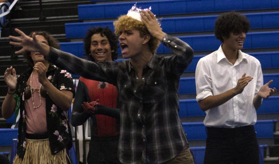 Senior Seth Norton cheers after being crowned Homecoming king at the pep rally Sept. 23.