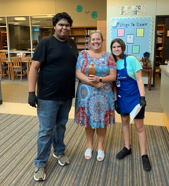 Head librarian Shelly Myers buys peach tea from life academics students. 