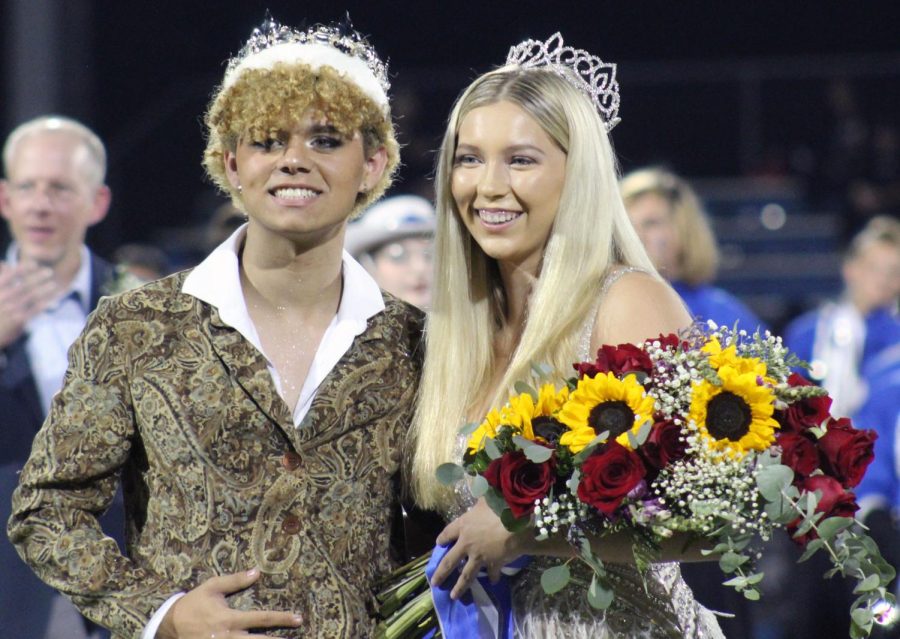 Homecoming+king+Seth+Norton+and+queen+Madison+Roedler+pose+for+pictures+together+after+Roedler+was+crowned+at+the+football+game+Sept.+23.