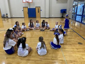 Young Badgers play a game alongside cheerleaders at the mini  camp Oct. 8.