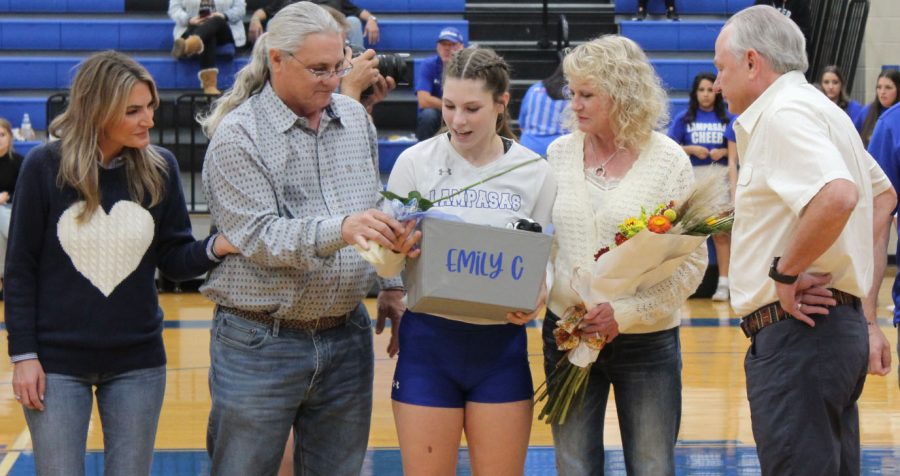Senior Emily Cain celebrates volleyball senior night with her family Oct. 25. 