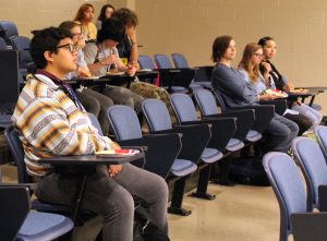 Seniors attend the Adulting 101 course about minor emergencies Friday. The course also started with a minilesson about making pulled pork sandwiches. 