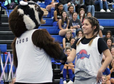 Junior Janie Resa, as Buster, and freshman Jacie Resa perform together at the pep rally Nov. 4.