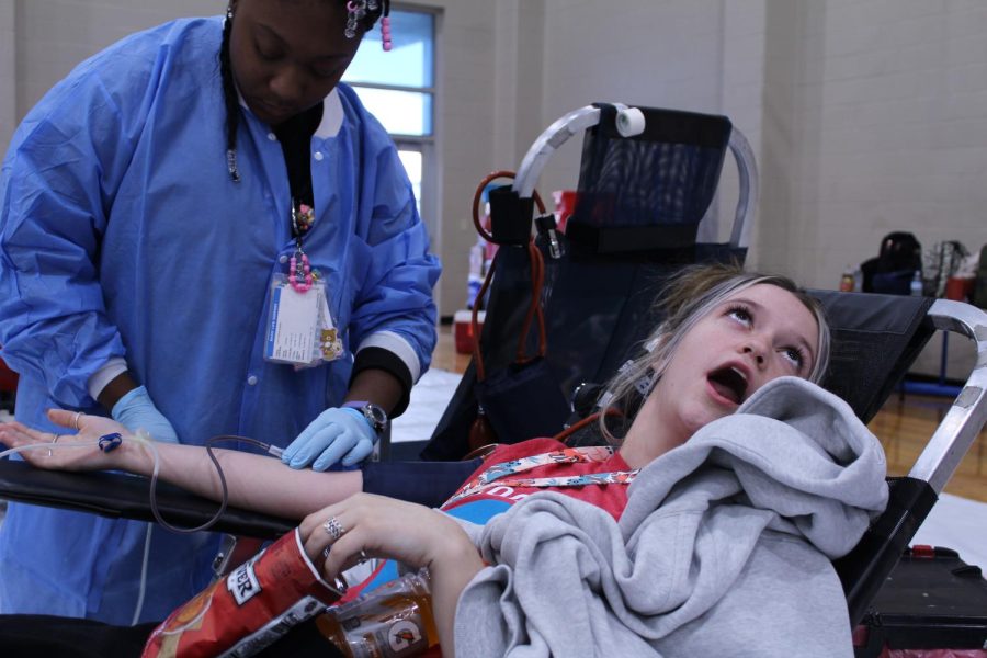 Senior Cooper Binder donates blood at the fall 2022 blood drive. HOSA and Carter BloodCare hosted a second blood drive at the high school Feb. 8.