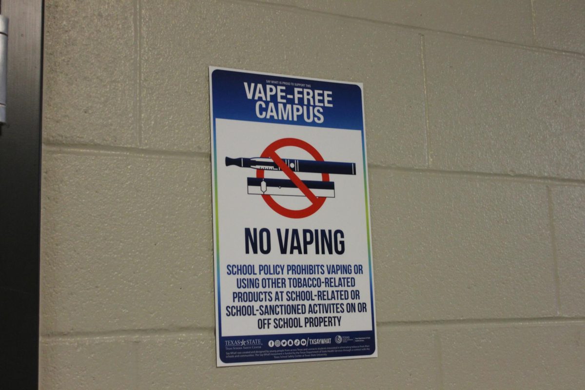 Vape-free campus signs are posted outside restrooms as a reminder for students. 