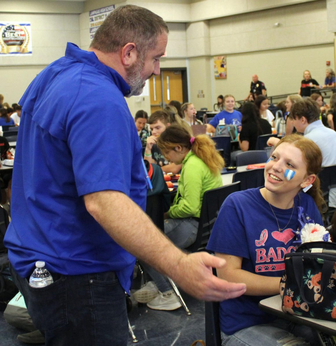 Attendance Officer and AP Kyle Black talks to sophomore Lydia Skiles during A Lunch Sept. 8.