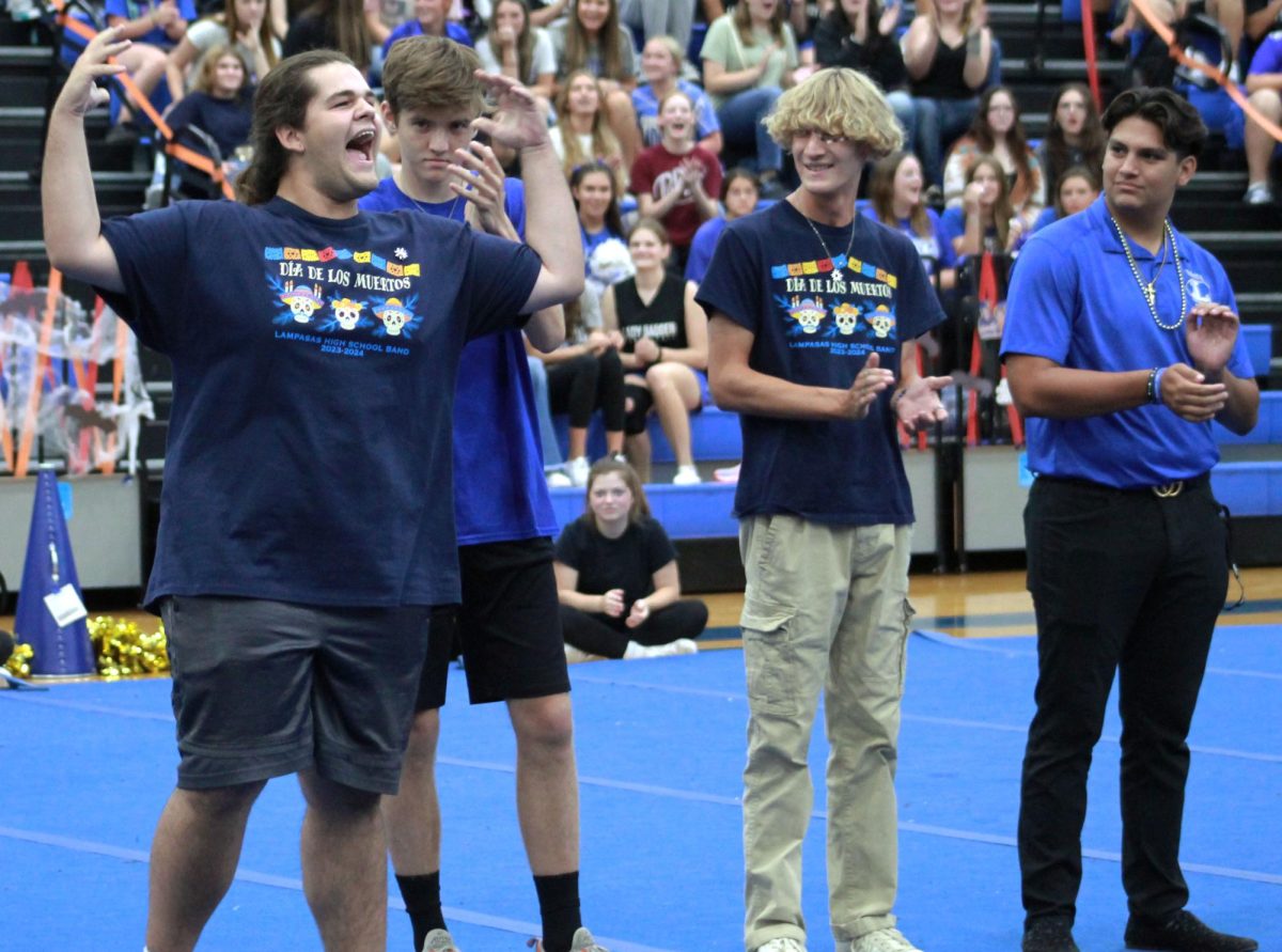 Senior Dylan Duvall reacts to the news he won Homecoming King at the pep rally.