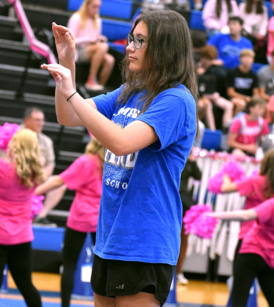 Junior Madyson Giffin conducts the band.