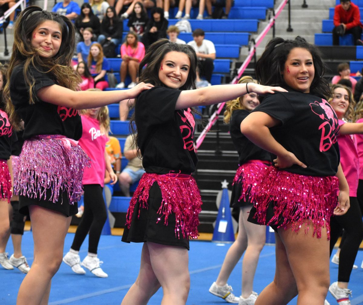 Seniors Liliana Miller, Bella Lindsey and Karissa Perez perform the cheerleaders Barbie routine.