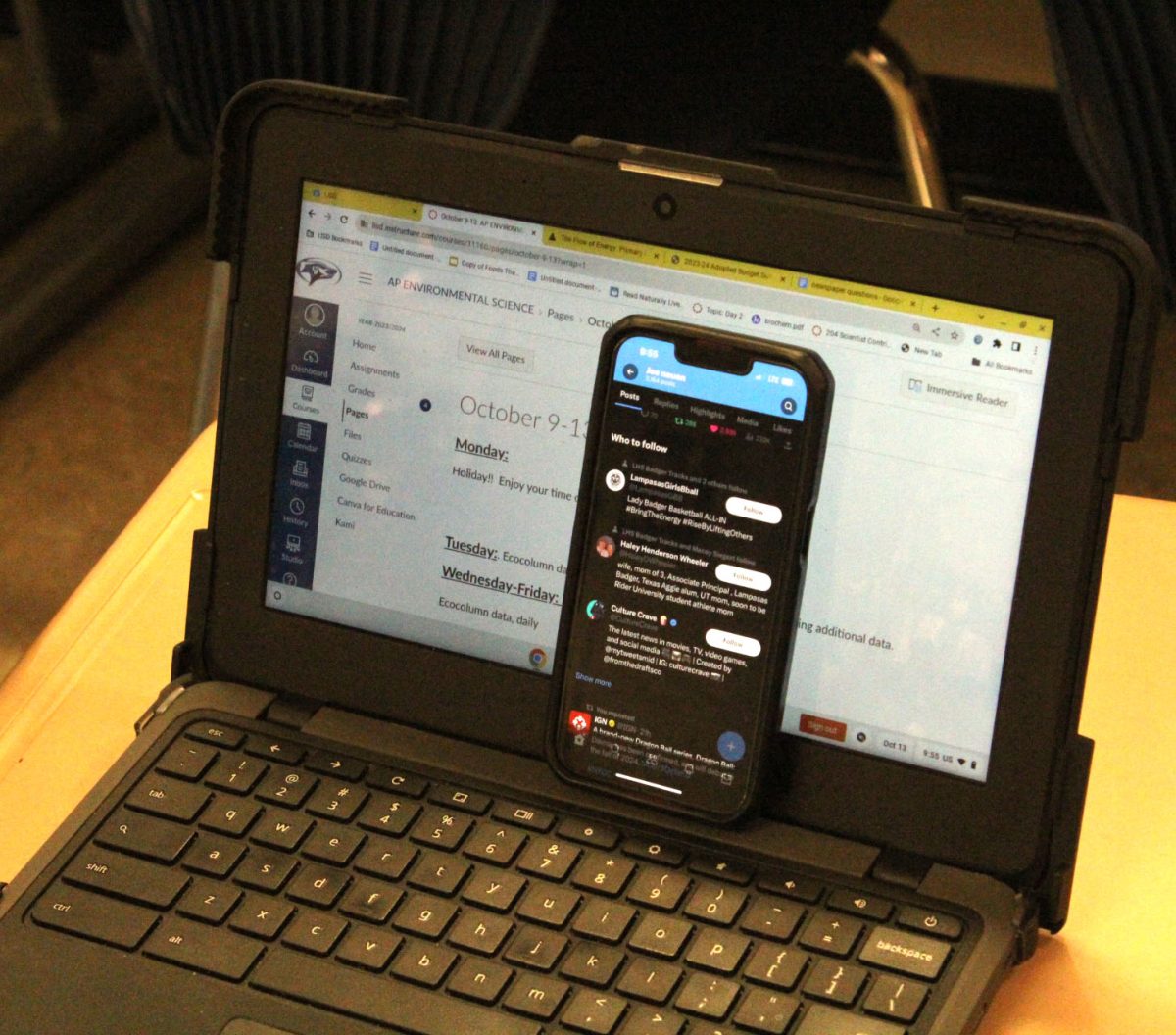 Students have been caught hiding cellphones behind their Chromebooks.