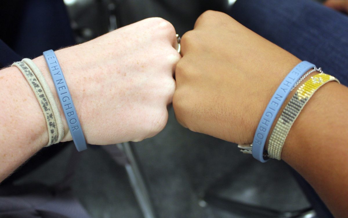 Students%2C+residents+and+businesses+passed+out+these+blue+bracelets+with+the+hope+of+inspiring+togetherness.