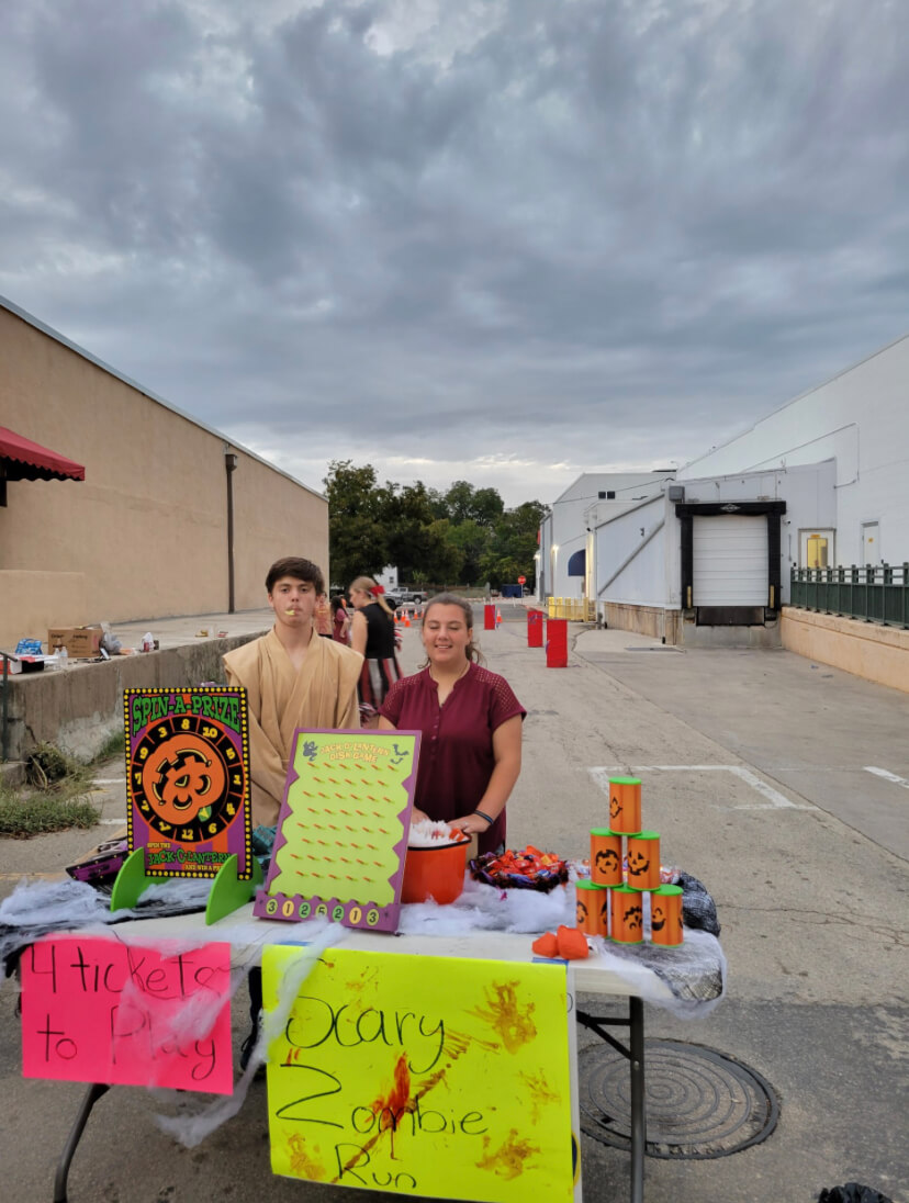 Junior Seth Kachel and freshman Abigail Justice work the Key Club booth at Squared Sillt OCt. 28.
Photo courtesy of Danelle Ecker